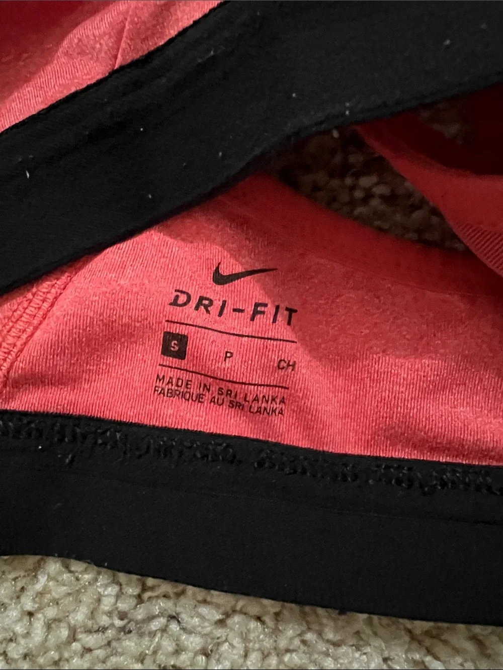 Nike Coral Pink V‑Neck Sports Bra with Black Band